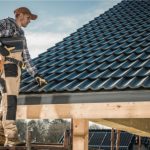 Carpenter Installing Roof Shingles